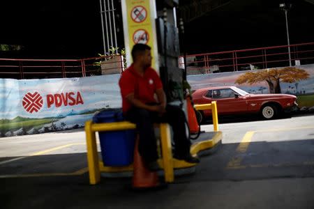 FILE PHOTO: The corporate logo of the state oil company PDVSA is seen at a gas station in Caracas, Venezuela August 29, 2017. REUTERS/Carlos Garcia Rawlins/File Photo