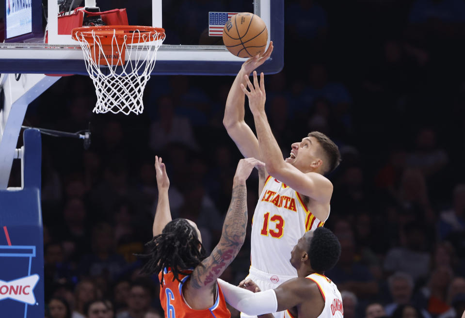 Nov 6, 2023; Oklahoma City, Oklahoma, USA; Atlanta Hawks guard Bogdan Bogdanovic (13) shoots as Oklahoma City Thunder forward <a class="link " href="https://sports.yahoo.com/nba/players/6724" data-i13n="sec:content-canvas;subsec:anchor_text;elm:context_link" data-ylk="slk:Jaylin Williams;sec:content-canvas;subsec:anchor_text;elm:context_link;itc:0">Jaylin Williams</a> (6) defends during the second half at Paycom Center. Oklahoma City won 126-117. Mandatory Credit: Alonzo Adams-USA TODAY Sports