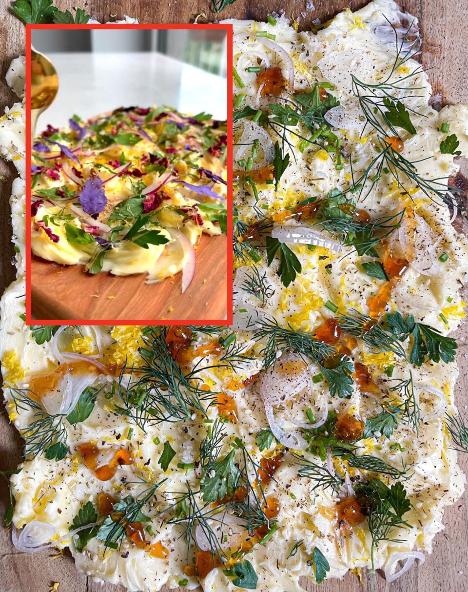 justine's butter board with purple edible flowers via screenshot vs the author's without the flowers, but with honey drizzled on top