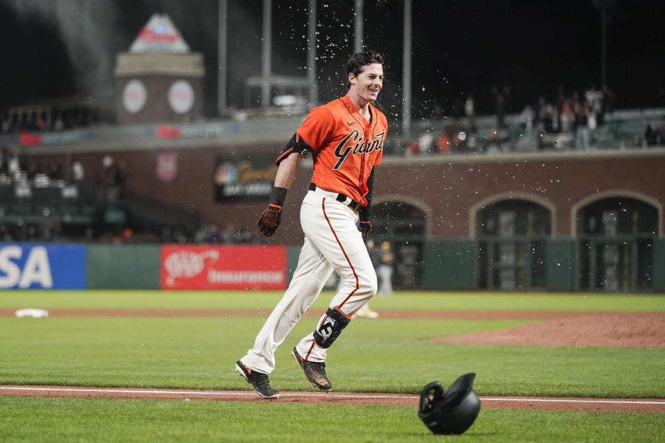 San Francisco Giants' Mike Yastrzemski celebrates after hitting a game-winning grand slam against the Milwaukee Brewers during the ninth inning of a baseball game in San Francisco, Friday, July 15, 2022. The Giants defeated the Brewers 8-5. (AP Photo/Godofredo A. Vásquez)