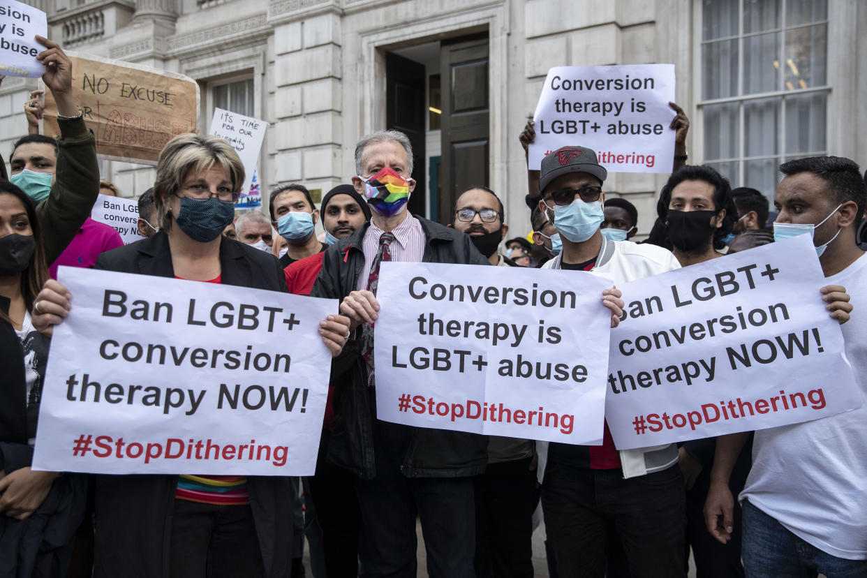 Peter Tatchell (C) and LGBT+ supporters hold placards expressing their opinion, during the demonstration against the use of Conversion Therapy outside UK Cabinet office. Peter Tatchell, together with the other LGBT+ supports and lead activists, have handed in letters to the UK Cabinet office demanding the government to ban Conversion Therapy. Handing in 7,500-signature petition & letter to Liz Truss. (Photo by May James/SOPA Images/LightRocket via Getty Images)