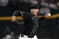 Arizona Diamondbacks pitcher Tommy Henry throws against the Colorado Rockies in the first inning during a baseball game, Saturday, March 30, 2024, in Phoenix. (AP Photo/Rick Scuteri)