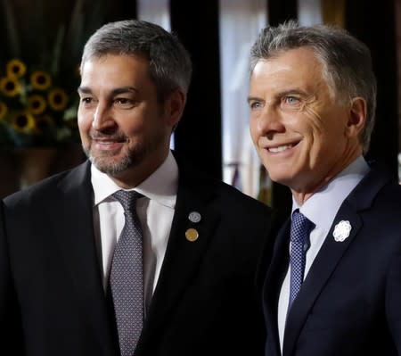 Argentina's President Mauricio Macri and his Paraguayan counterpart Mario Abdo Ben’tez pose at the 54th Summit of Heads of State of Mercosur and Associated States, in Santa Fe