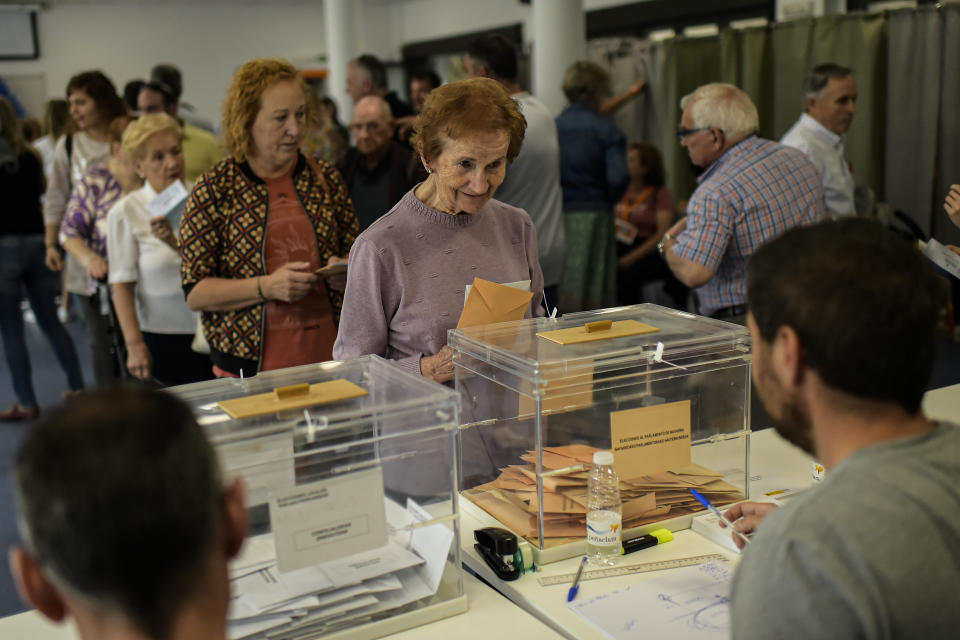 Maria Iturriaga, 88, prepares to cast her vote at a polling station during regional elections, in Olite, around 38 kms (23 miles) from Pamplona, northern Spain, Sunday, May 28, 2023. (AP Photo/Alvaro Barrientos)