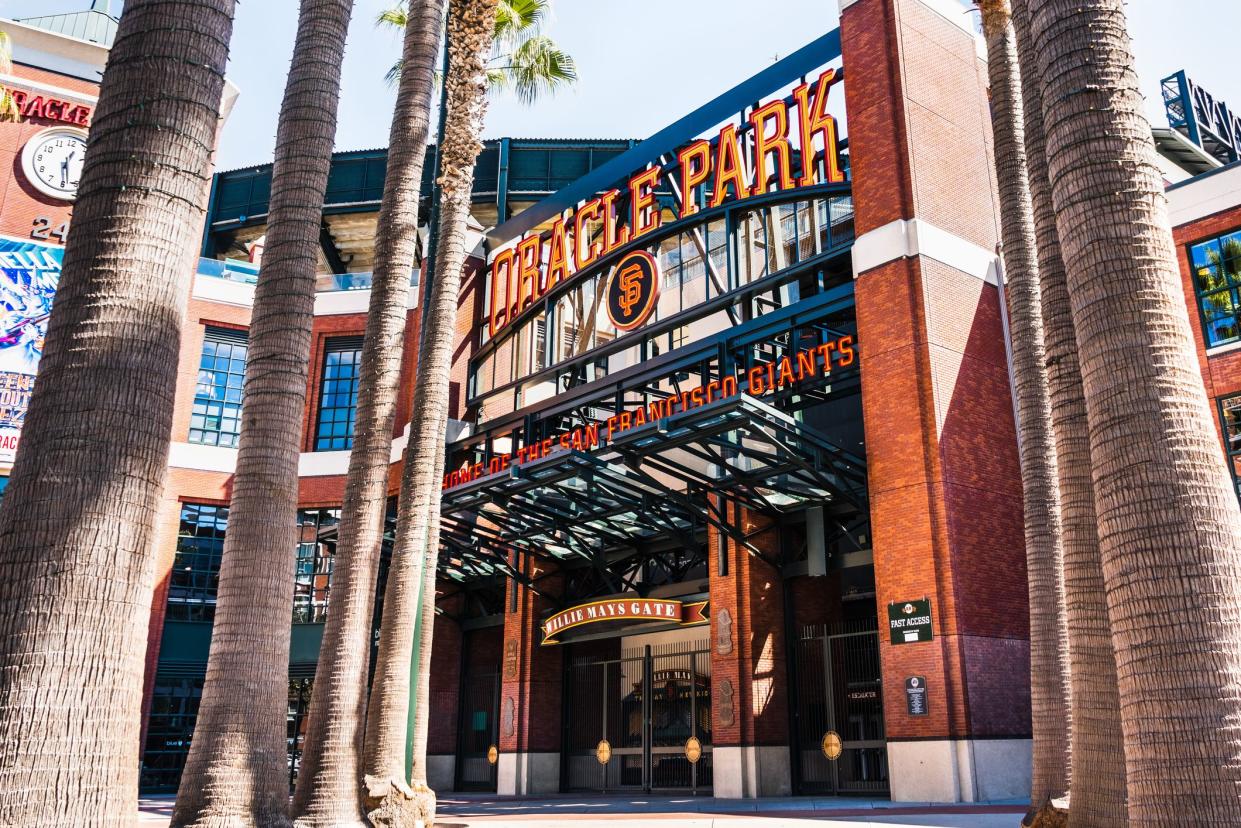 Entrance to Oracle Park, San Francisco, home of the San Francisco Giants, Willie Mays Gate framed by palm tree stalks