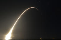 FILE - This time exposure photo shows a SpaceX Falcon 9 rocket, with a payload including two lunar rovers from Japan and the United Arab Emirates, launching from Launch Complex 40 at the Cape Canaveral Space Force Station in Cape Canaveral, Fla., on Dec. 11, 2022. But later in April 2023, the spacecraft from a Japanese company apparently crashed while attempting to land on the moon. Japan now hopes to make the world's first "pinpoint landing" on the moon early Saturday, Jan. 20, 2024, joining a modern push for lunar contact with roots in the Cold War-era space race between the United States and the Soviet Union. (AP Photo/John Raoux, File)