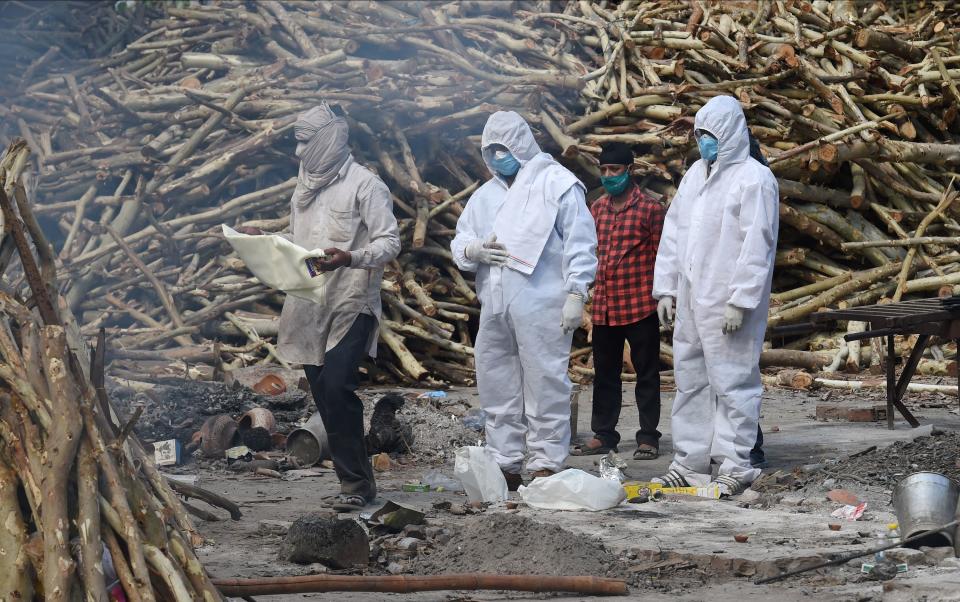 Mass cremation of COVID-19 victims at Ghazipur Cremation Ground on Friday as coronavirus cases surge in New Delhi.