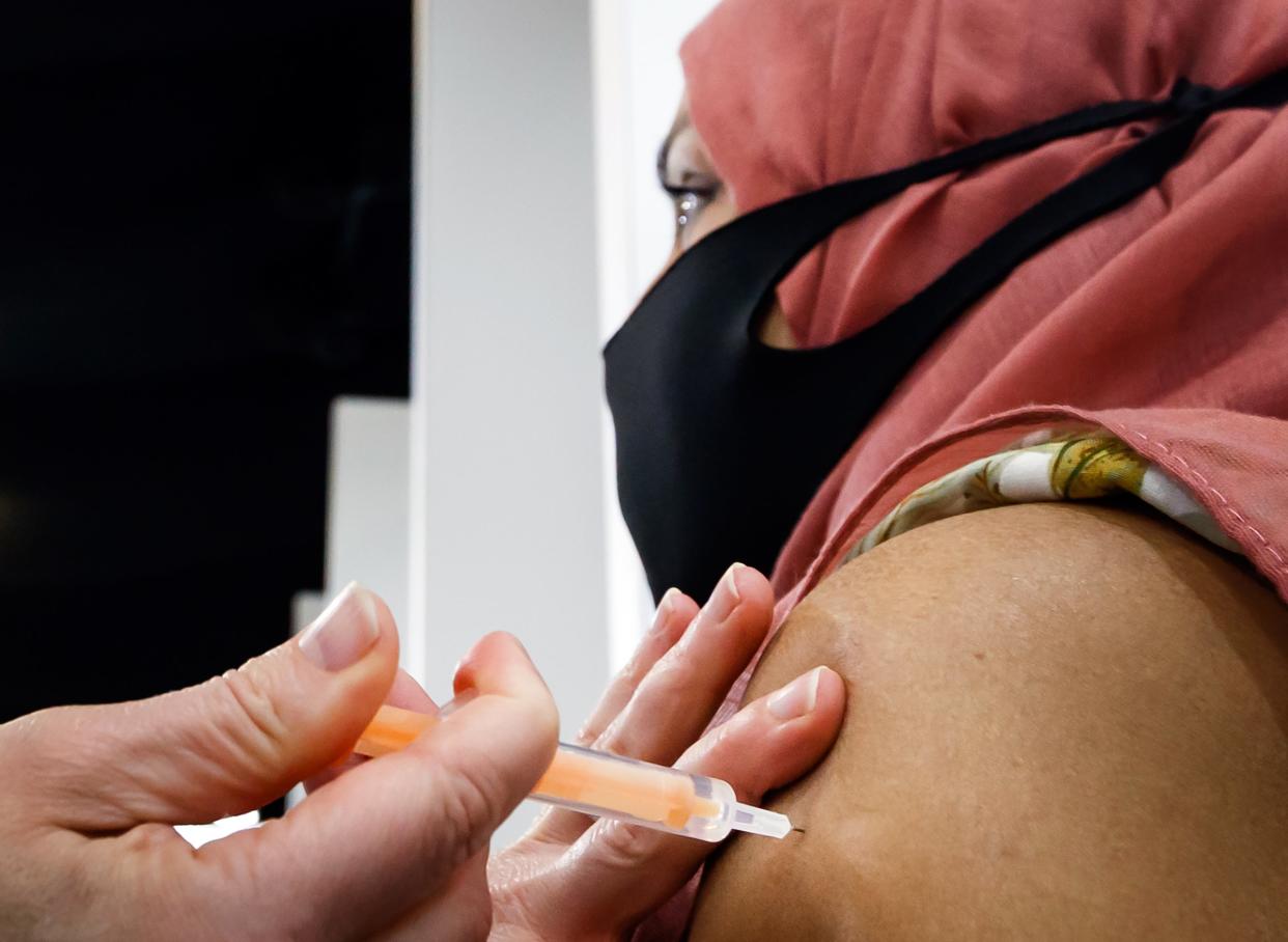 A woman receives an injection of the the Oxford/AstraZeneca coronavirus vaccine (PA Wire)