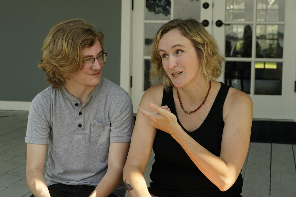 Katie Rives, mother of Ray Walker, 17, left, discusses her emotions over her oldest son having to move to Virginia for continued gender-affirming care and the effects on his family, Wednesday, June 28, 2023, in Madison County, Miss. This year, Republican Gov. Tate Reeves signed legislation banning gender-affirming care for anyone younger than 18. (AP Photo/Rogelio V. Solis)