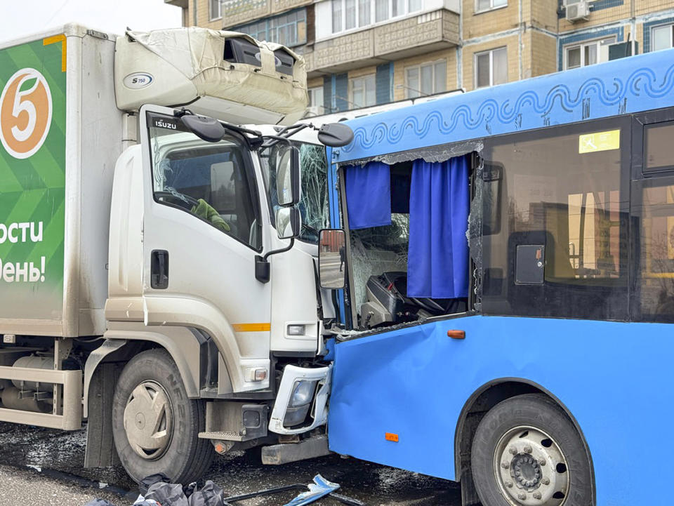 This photo released by Belgorod region governor Vyacheslav Gladkov's telegram channel on Saturday, March 16, 2024, shows a broken truck and a bus after shelling from the Ukrainian side in Belgorod, Russia. A Russian regional governor says two people have been killed in Ukrainian shelling of the city of Belgorod, close to the border with Ukraine. Three others were wounded. (Belgorod region governor Vyacheslav Gladkov telegram channel via AP)