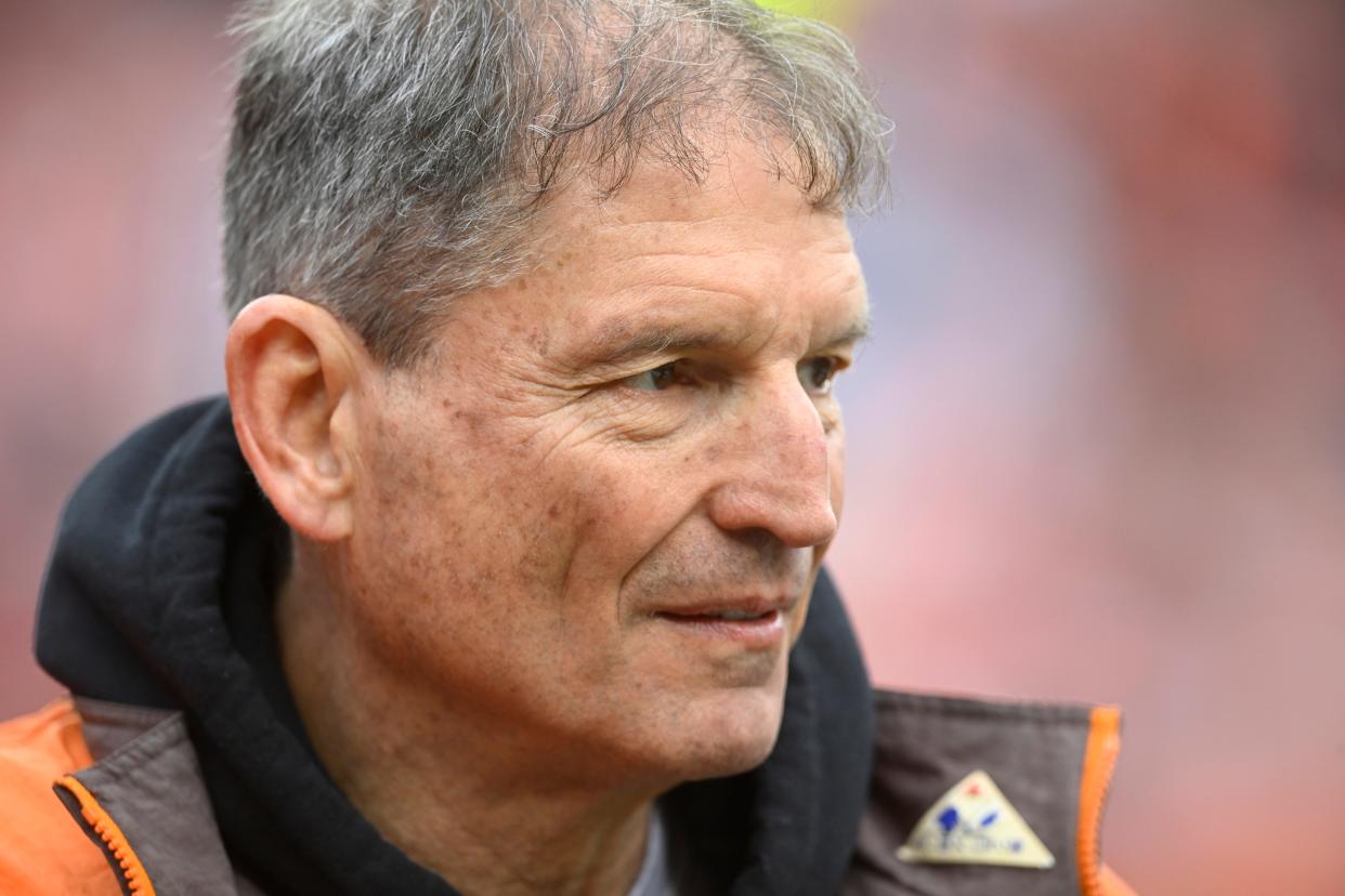 Former Cleveland Browns quarterback Bernie Kosar stands on the field before an NFL football game between the Tampa Bay Buccaneers and the Cleveland Browns, Sunday, Nov. 27, 2022, in Cleveland. The Browns won 23-17 in overtime. (AP Photo/David Richard)