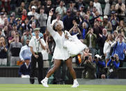 Serena Williams of the US waves as she leaves the court after losing to France's Harmony Tan in a first round women’s singles match on day two of the Wimbledon tennis championships in London, Tuesday, June 28, 2022. (John Walton/PA via AP)