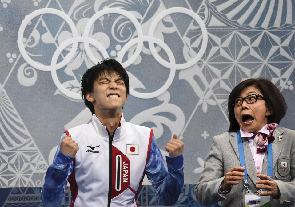 Yuzuru Hanyu of Japan, reacts as he receives his results after competing in the men's short program figure skating competition at the Iceberg Skating Palace during the 2014 Winter Olympics, Thursday, Feb. 13, 2014, in Sochi, Russia. (AP Photo/The Canadian Press, Paul Chiasson)