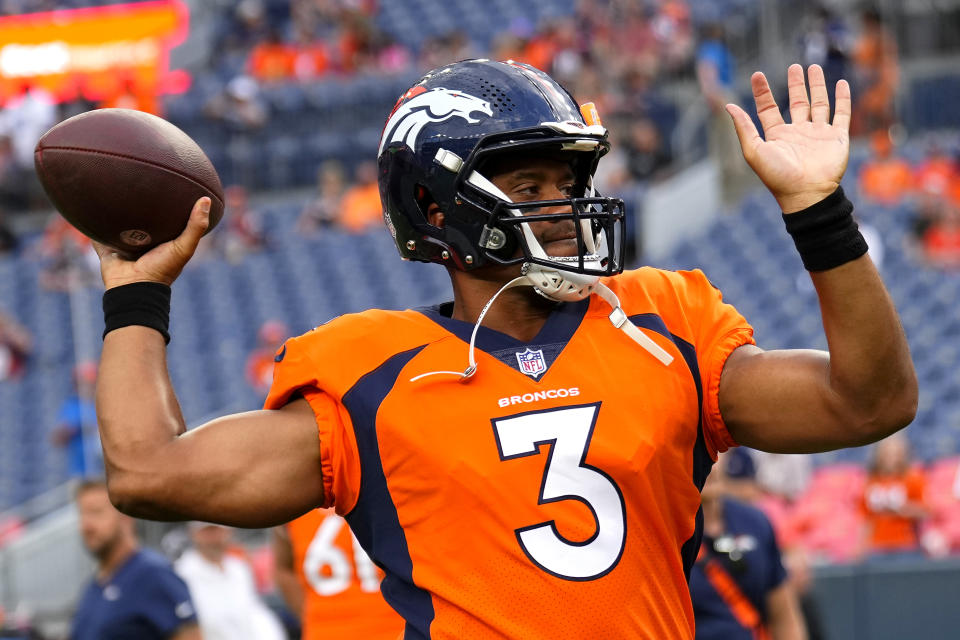 Denver Broncos quarterback Russell Wilson (3) warms up prior to an NFL preseason football game against the Dallas Cowboys, Saturday, Aug. 13, 2022, in Denver. (AP Photo/Jack Dempsey)