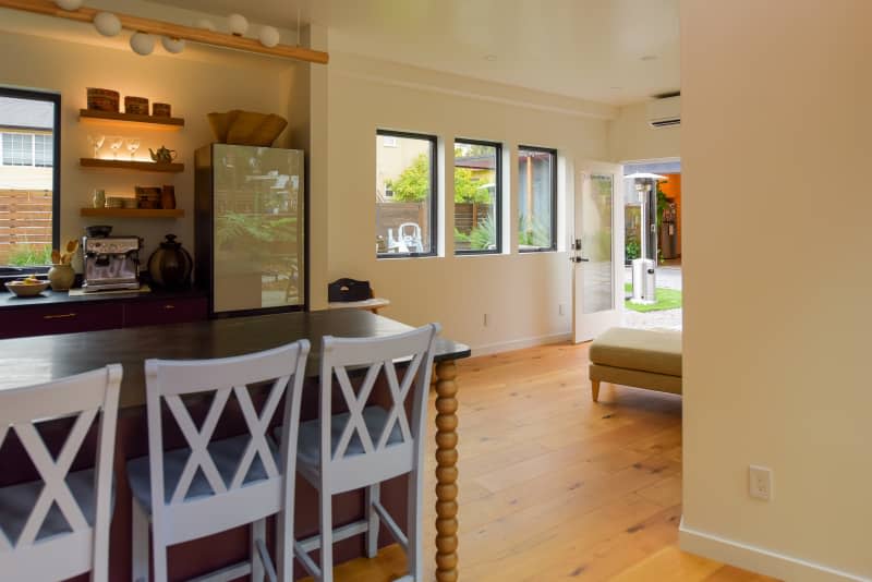 View of neutral toned room from kitchen.