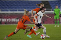 United States' Rose Lavelle, right, dribbles past Netherlands' Jackie Groenen during a women's quarterfinal soccer match at the 2020 Summer Olympics, Friday, July 30, 2021, in Yokohama, Japan. (AP Photo/Kiichiro Sato)