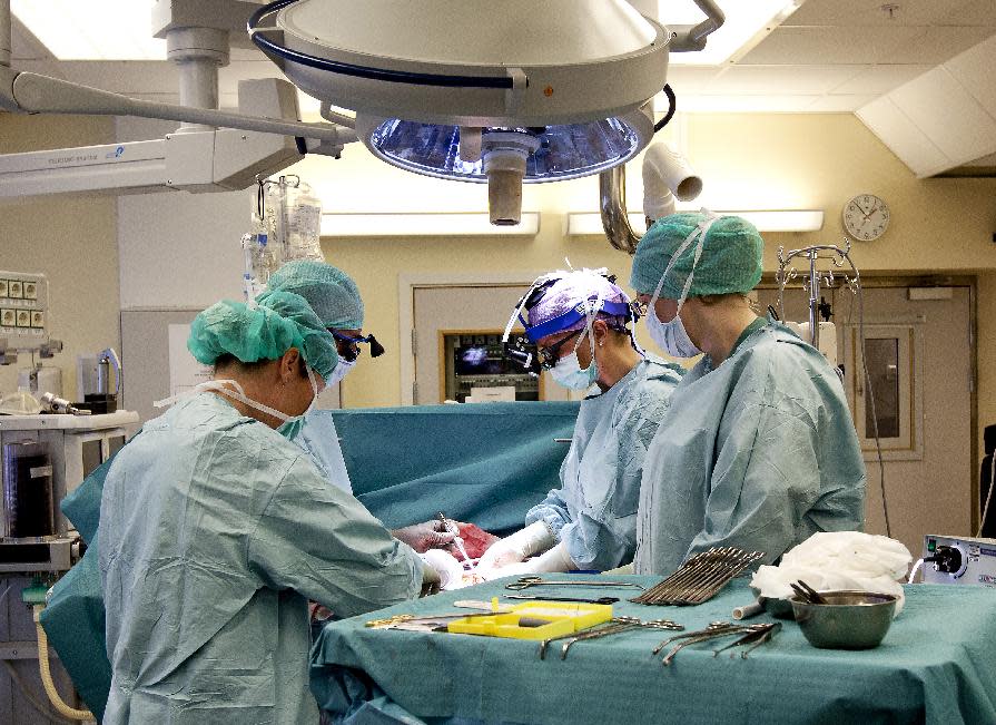 In this April 4, 2012 photo made available by the University of Goteborg in Sweden, the Swedish research team practices before the operations to transplant wombs at the Sahlgrenska Hospital in Goteborg, Sweden. Nine women in Sweden have successfully received transplanted wombs donated from relatives and will soon try to become pregnant, the doctor in charge of the pioneering project has revealed. “This is a new kind of surgery,” Dr. Mats Brannstrom told The Associated Press. Brannstrom is leading the initiative at the University of Goteborg and will run workshops for other doctors on how to perform womb transplants later this year. “We have no textbook to look at,” he said. (AP Photo/University of Goteborg, Johan Wingborg)