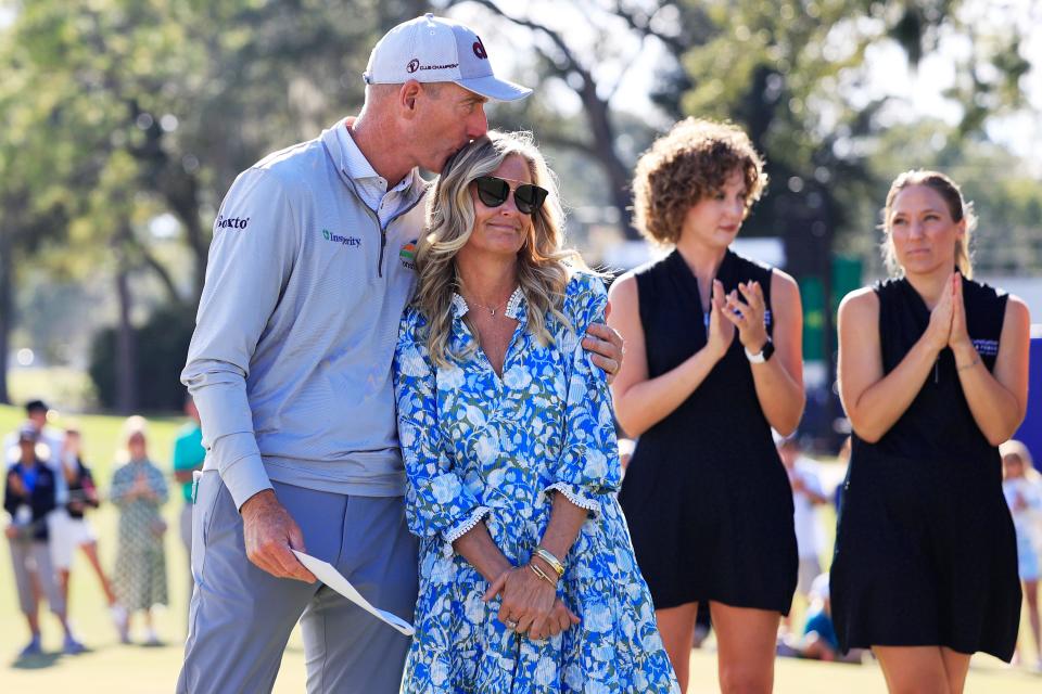 Tournament hosts Jim Furyk kisses wife Tabitha Furyk before the trophy presentation during the third and final round of the Constellation Furyk & Friends PGA Tour Champions golf tournament Sunday, Oct. 8, 2023 at Timuquana Country Club. Brett Quigley won at 11 under par, one stroke over Steven Alker. [Corey Perrine/Florida Times-Union]