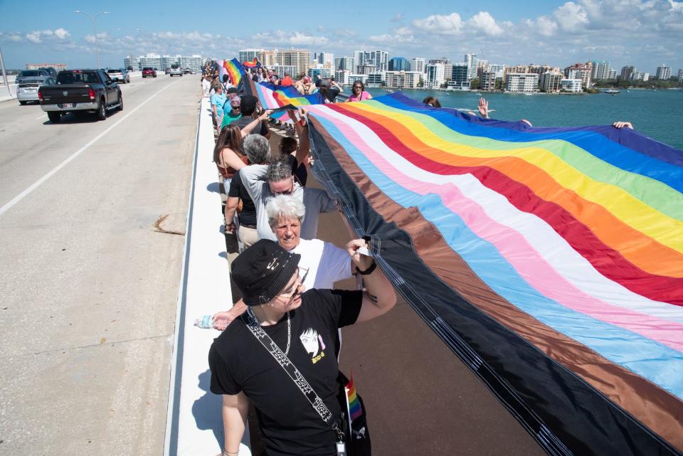 Hundreds of LGBTQ residents and their supporters rallied and waved a 700-foot LGBTQ pride flag over the Ringling Bridge in downtown Sarasota on Feb. 27, 2022, in opposition to Florida's Parental Rights in Education legislation, which critics commonly refer to as the state's "Don't Say Gay" law.