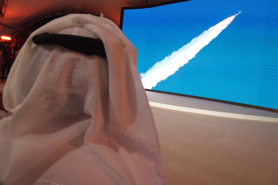 An Emirati man watches the launch of the "Amal" or "Hope" space probe at the Mohammed bin Rashid Space Center in Dubai, United Arab Emirates, Monday, July 20, 2020. A United Arab Emirates spacecraft, the "Amal" or "Hope" probe, blasted off to Mars from Japan early Monday, starting the Arab world's first interplanetary trip. (AP Photo/Jon Gambrell)