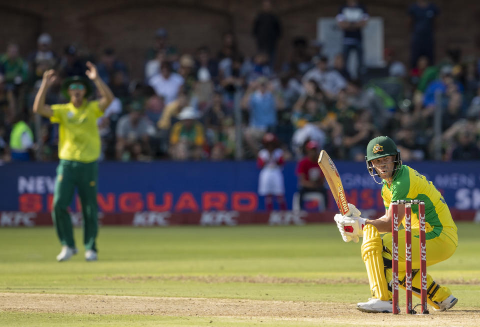 Australia's batsman David Warner, right, reacts after misplaying a delivery from South Africa's batsman Anrich Nortje during the 2nd T20 cricket match between South Africa and Australia at St George's Park in Port Elizabeth, South Africa, Sunday, Feb. 23, 2020. (AP Photo/Themba Hadebe)