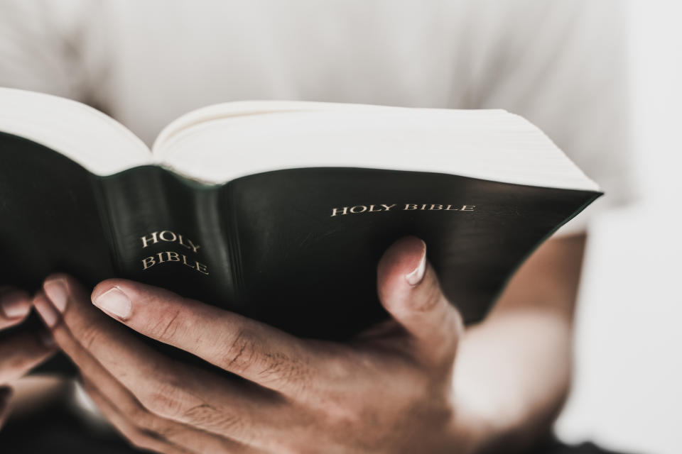 Prayer and meditation can help provide a quiet space for self-reflection during times of stress. (Image via Getty Images). 