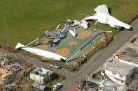 <p>Remains of a shed is scattered over a basketball court after Hurricane Maria near Loiza, Puerto Rico, Oct. 6, 2017. (Photo: Lucas Jackson/Reuters) </p>