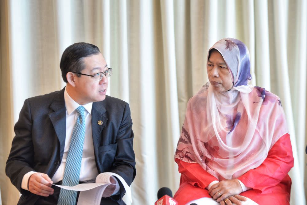 Finance Minister Lim Guan Eng and Housing and Local Government Minister Zuraida Kamaruddin are pictured during a press conference in Putrajaya August 22, 2019. — Picture by Shafwan Zaidon