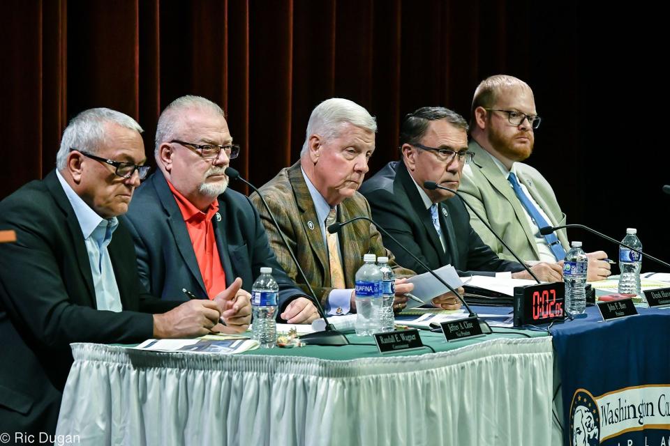 Washington County Commissioners, Randy Wagner, left, Jeff Cline, John Barr, Derek Harvey and Wayne Keefer listen to people speaking during a budget hearing last year.