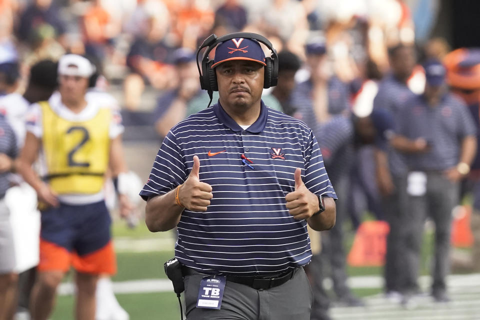 FILE - Virginia head coach Tony Elliott gestures on the field during the second half of an NCAA college football game against Illinois Saturday, Sept. 10, 2022, in Champaign, Ill. The Virginia Cavaliers finally are getting back on a field to play football again. (AP Photo/Charles Rex Arbogast, File)