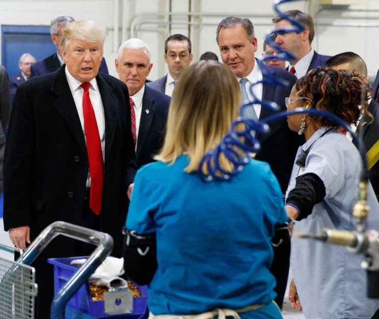 President-elect Donald Trump and Vice President-elect Mike Pence talk to workers during a visit to a Carrier factory, Dec. 1, 2016, in Indianapolis. (Photo: Evan Vucci/AP)