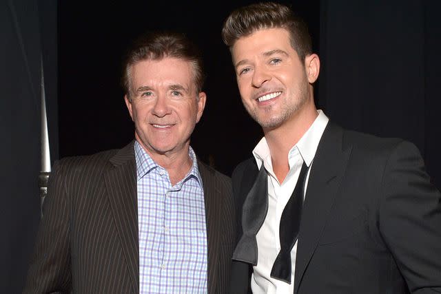 Charley Gallay/WireImage Alan and Robin Thicke