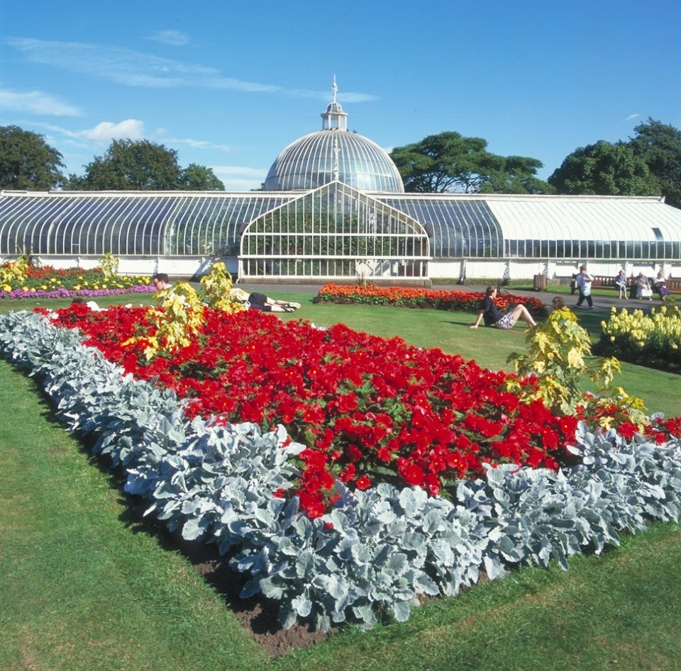 This undated photo provided by Glasgow City Marketing Bureau shows the Botanic Gardens in Glasgow, Scotland, an internationally renowned garden in the heart of Glasgow's West End. It includes more than 50 acres of formal gardens, woodland walks and glasshouses filled with plants. It's open daily and is free to visit. (AP Photo/Glasgow City Marketing Bureau)