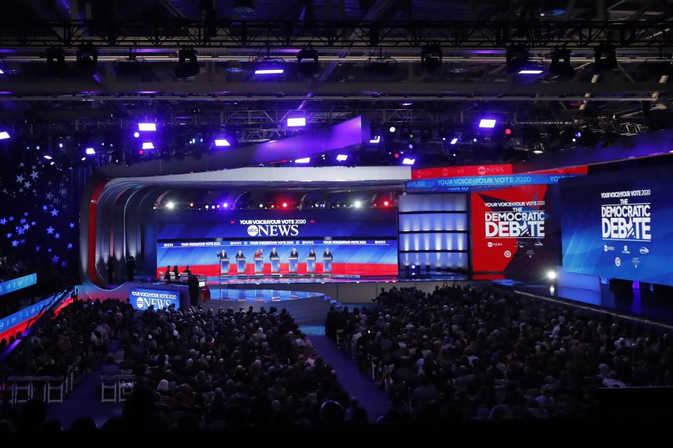 From left, Democratic presidential candidates entrepreneur Andrew Yang, former South Bend Mayor Pete Buttigieg, Sen. Bernie Sanders, I-Vt., former Vice President Joe Biden, Sen. Elizabeth Warren, D-Mass., Sen. Amy Klobuchar, D-Minn., and businessman Tom Steyer participate Friday, Feb. 7, 2020,in a Democratic presidential primary debate hosted by ABC News, Apple News, and WMUR-TV at Saint Anselm College in Manchester, N.H. (AP Photo/Elise Amendola)