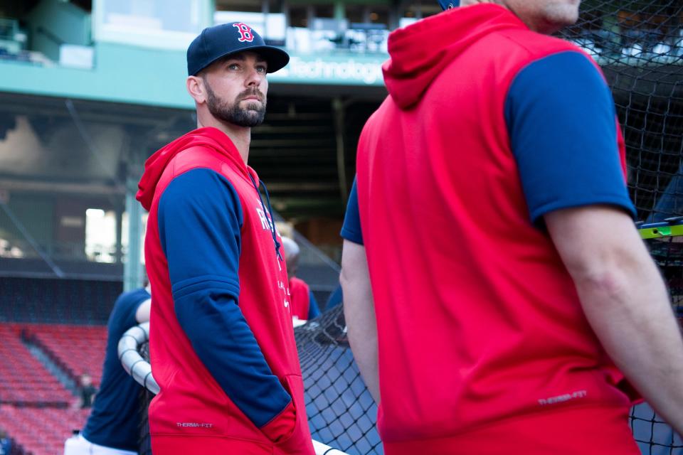 Portsmouth High School graduate Mike Montville, left, watches Red Sox batting practice before a game against the Kansas City Royals at Fenway Park in September 2022. Montville, a hitting coach with Red Sox Triple-A affiliate Worcester Red Sox, was told Monday the organization wasn't bringing him back in 2024.