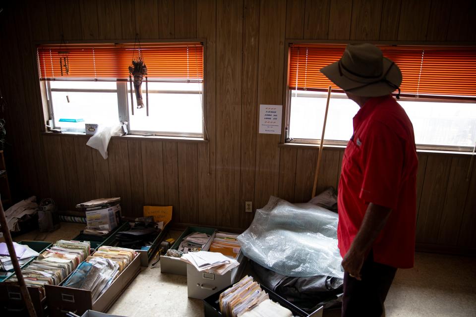 Grant Erickson, a third generation owner of Erickson & Jensen Shrimp Packers  on Fort Myers Beach, stands in the business office that was flooded by the storm surge from Hurricane Ian. He and his daughter, Anna, and his employees are working to keep their stake in the industry alive after it was virtually destroyed by Hurricane Ian. Almost all of their boat were washed on shore or destroyed by the storm.