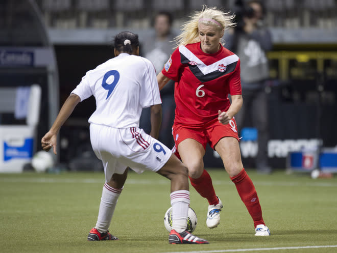 VANCOUVER, CANADA - JANUARY 21: Kaylyn Kyle #6 of Canada tries to get around Dayanay Baro #9 of Cuba during the second half of the 2012 CONCACAF Women's Olympic Qualifying Tournament at BC Place on January 21, 2012 in Vancouver, British Columbia, Canada. (Photo by Rich Lam/Getty Images)