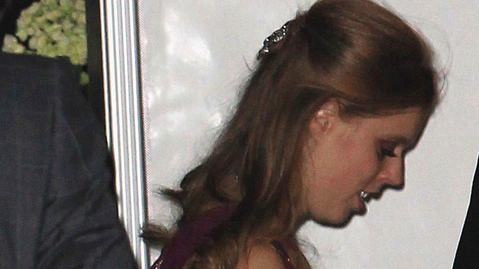 Princess Beatrice in trainers and a maroon dress