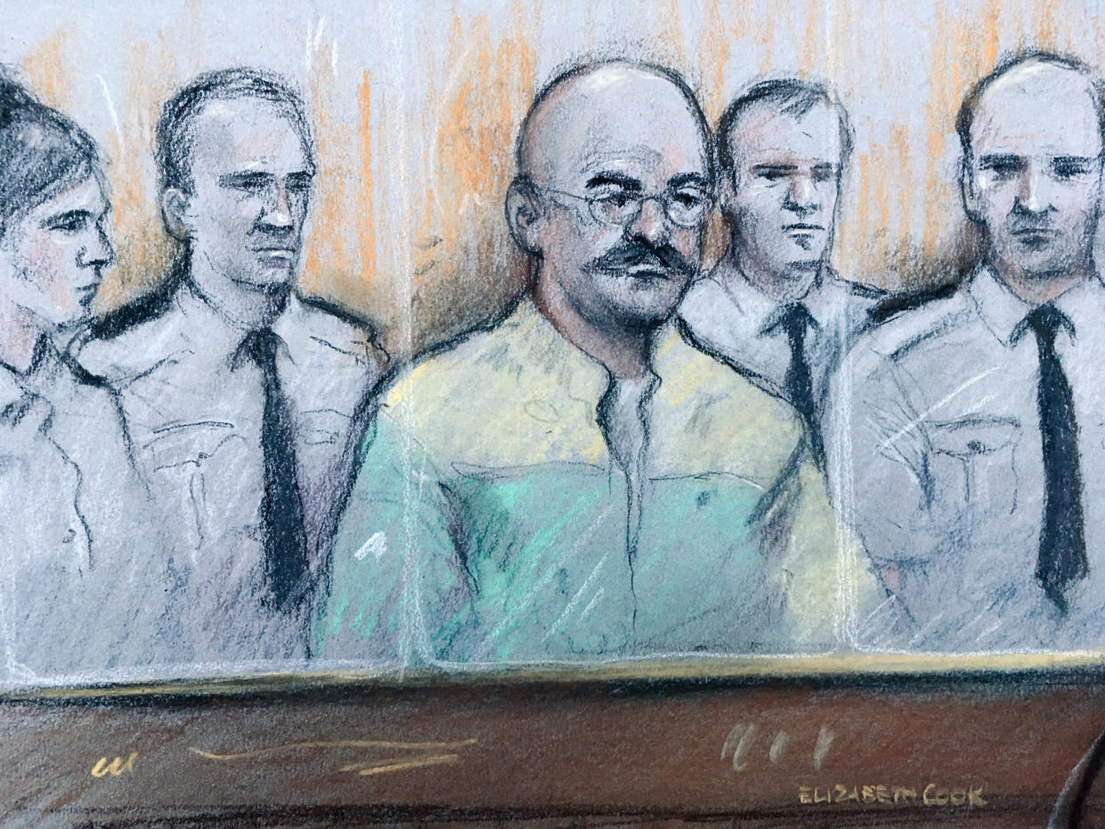 Court artist sketch by Elizabeth Cook of notorious inmate Charles Bronson (centre), listening as prison governor Mark Docherty gives evidence at Leeds Crown Court, during Bronson’s trial over allegations he attacked prison governor Mark Docherty (Elizabeth Cook/PA)