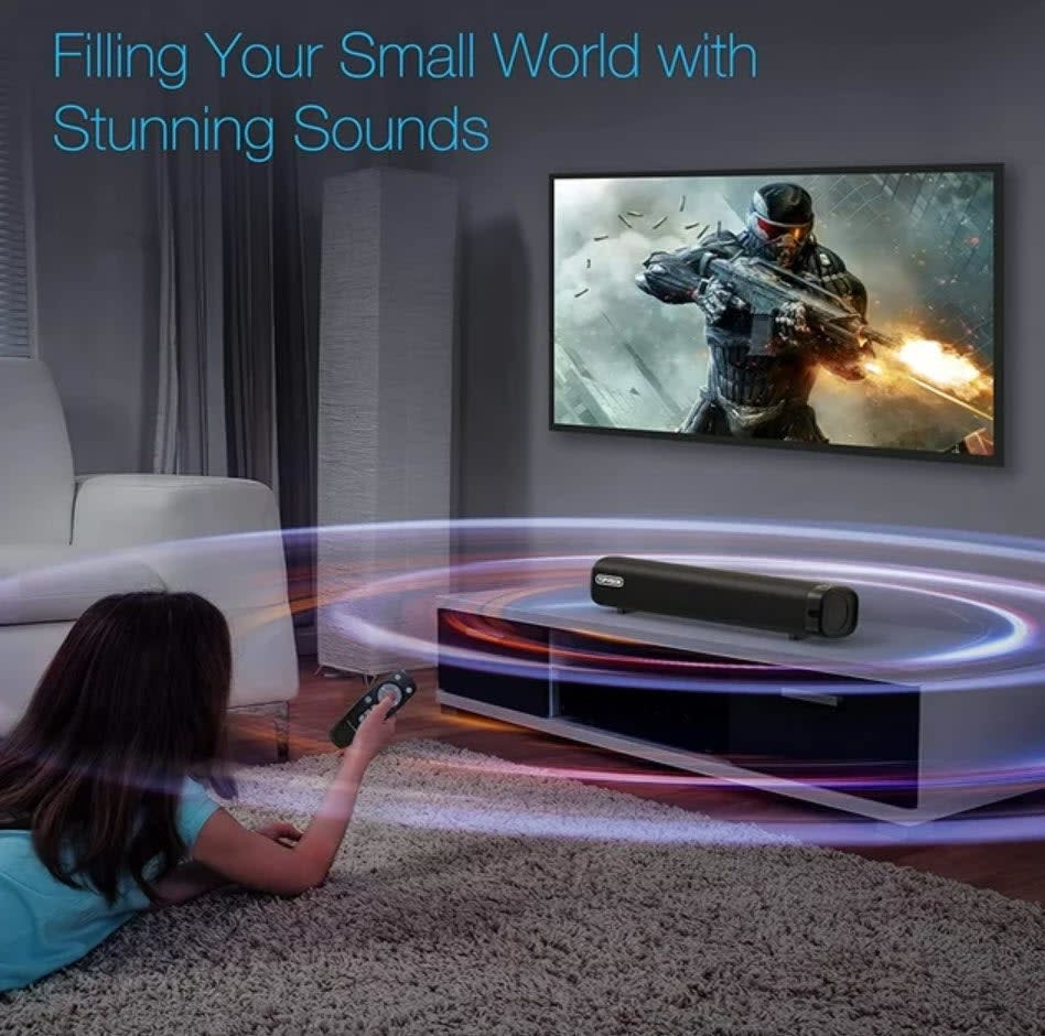 Child plays video game with soundbar enhancing audio experience