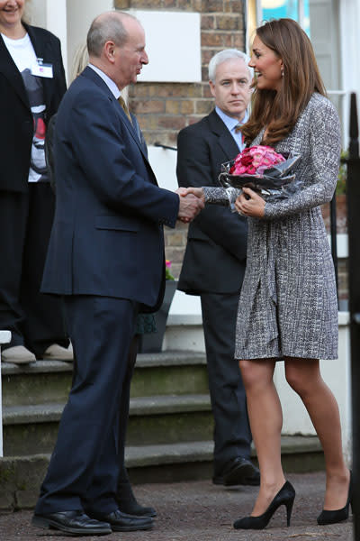 <p>A Caribbean 'babymoon' sure did the trick. Kate Middleton was glowing at her first official public appearance since her vacation with husband Prince William. The tanned Duchess showed off a burgeoning baby bump Tuesday morning while visiting Hope House in London, a treatment centre run by the charity Action on Addiction. (Photo by Neil Mockford/FilmMagic)</p>