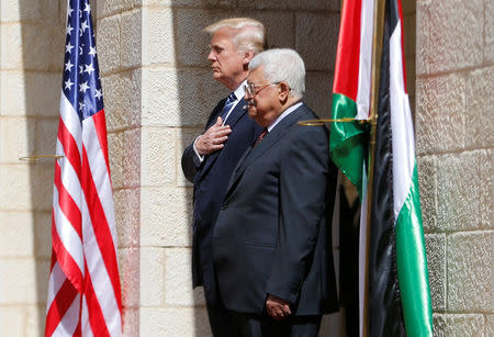 Palestinian President Mahmoud Abbas stands next to U.S. President Donald Trump during a reception ceremony at the presidential headquarters in the West Bank town of Bethlehem, May 23, 2017. REUTERS/Mohamad Torokman