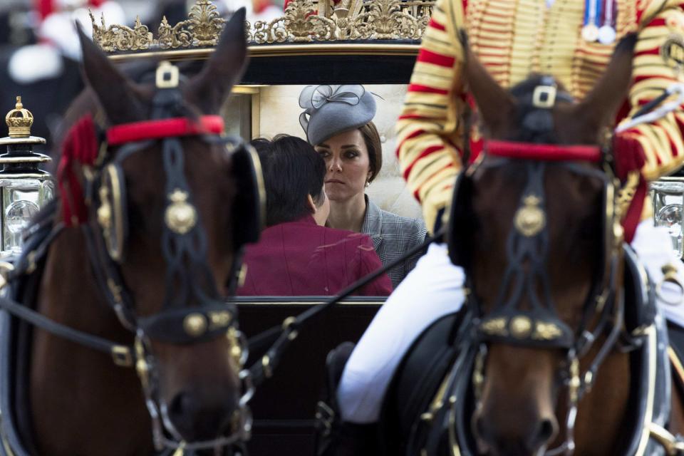 Britain's Catherine, Duchess of Cambridge travels with Singapore's Grace Fu Hai Yien for the carriage procession to Buckingham Palace, as part of the ceremonial welcome ceremony for Singapore's President Tony Tan at the start of a state visit at Horse Guards Parade in London October 21, 2014. The President of Singapore Tony Tan and his wife Mary Chee started a four day state visit to Britain on Tuesday. REUTERS/Matt Dunham/pool (BRITAIN - Tags: ENTERTAINMENT POLITICS ROYALS)