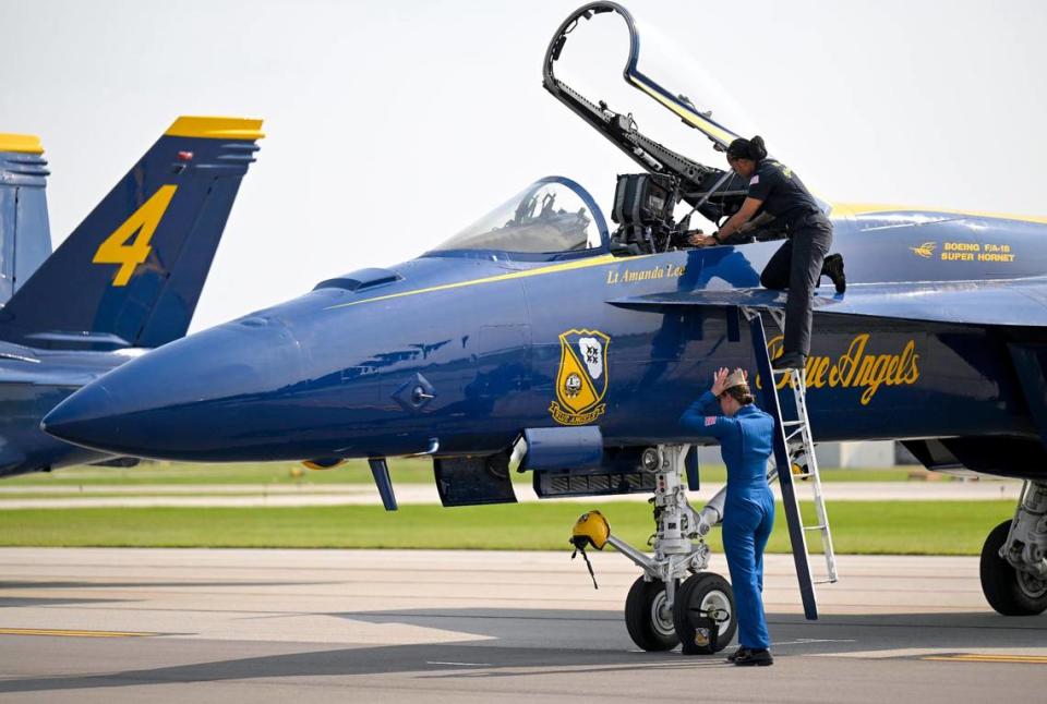 U.S. Navy Lt. Amanda Lee adjusts her cap after deplaning after the Blue Angels arrived on Thursday at the New Century AirCenter in Gardner, Kansas.