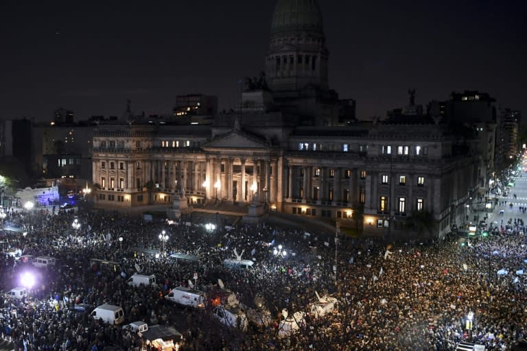 Thousands demonstrate outside the Congress in Buenos Aires to demand the Senate approve the lifting of former president Cristina Kirchner's immunity as part of a anti-corruption investigation, on August 21, 2018