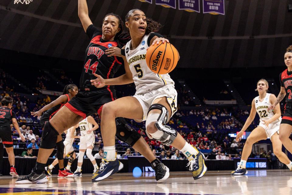 Michigan Wolverines' Laila Phelia drives to the basket against UNLV Rebels forward Alyssa Brown (44) during the second half in the women's NCAA tournament at Pete Maravich Assembly Center in Baton Rouge, Louisiana, on Friday, March 17, 2023.