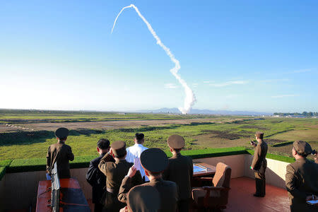 North Korean leader Kim Jong Un watches the test of a new-type anti-aircraft guided weapon system organised by the Academy of National Defence Science in this undated photo released by North Korea's Korean Central News Agency (KCNA) May 28, 2017. KCNA/via REUTERS