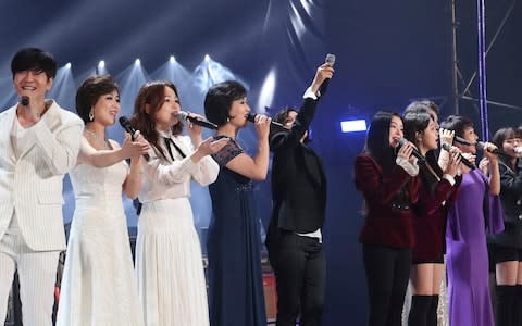 South and North Korean singers sing together during their joint concert in Pyongyang - Credit: Korea Pool via AP