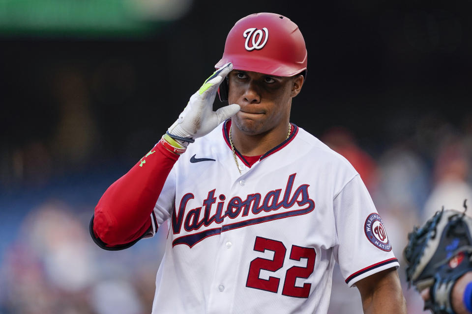 Washington Nationals' Juan Soto acknowledges the New York Mets dugout as he steps in the batter's box during the first inning of a baseball game at Nationals Park, Monday, Aug. 1, 2022, in Washington. (AP Photo/Alex Brandon)