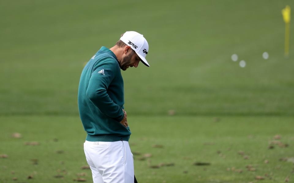 Dustin Johnson of the United States practices on the range prior to his tee time - Credit: GETTY